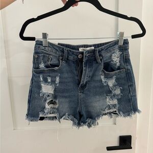 Destroyed denim shorts